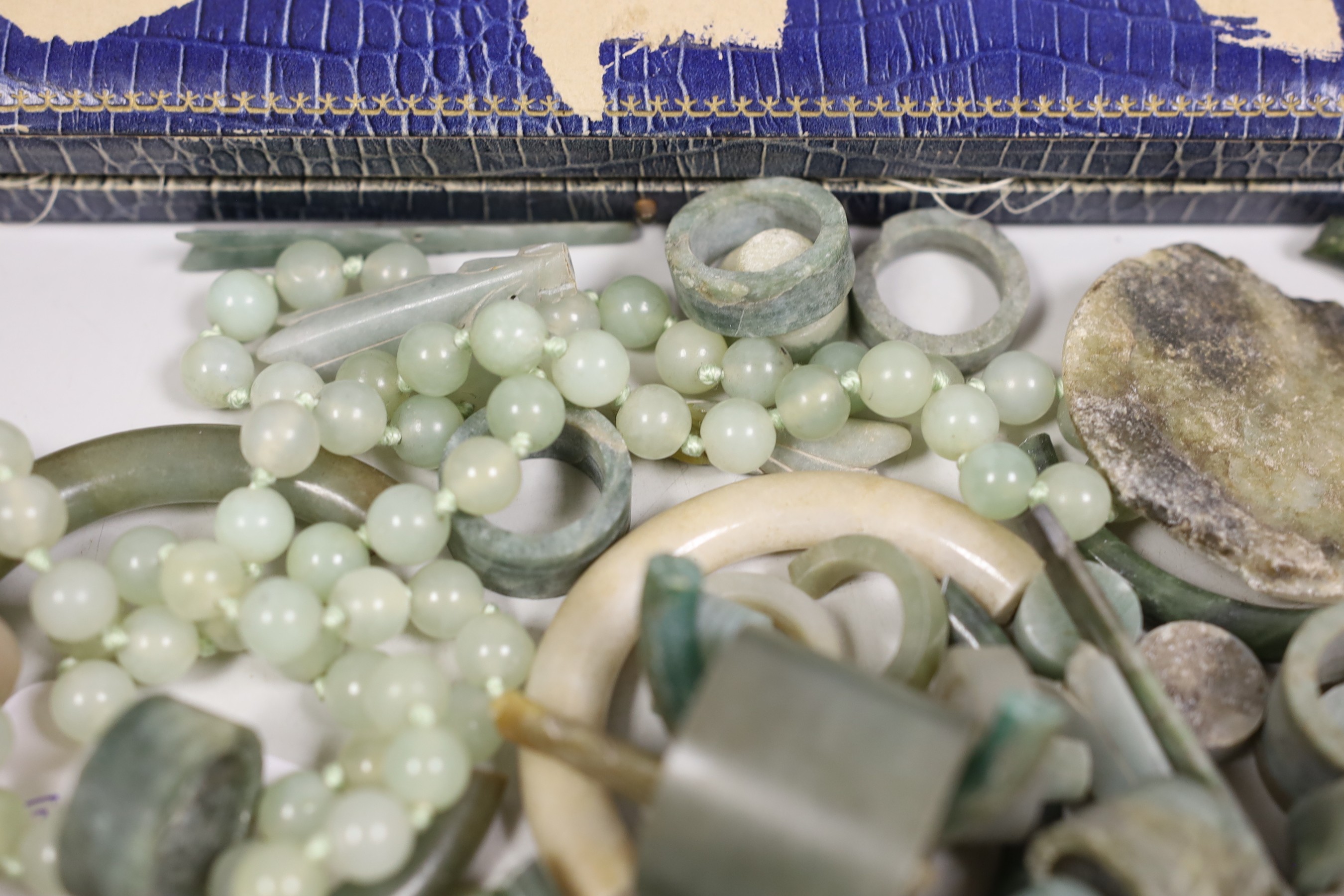 A Chinese hardstone bead necklace and related jade, jadeite etc. jewellery parts